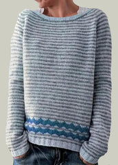 Striped knitted sweater with patterned hem