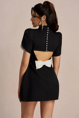 Black mini dress with accentuated shoulders