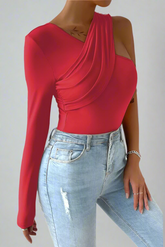 Red asymmetrical top with draped details and long sleeves