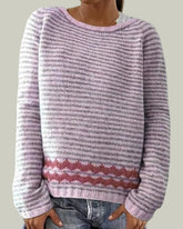Striped knitted sweater with patterned hem