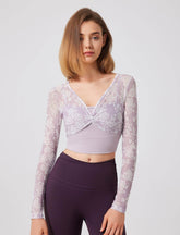 Floral patterned crop top with mesh sleeves