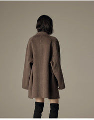 Oversized double-breasted coat with shawl collar.