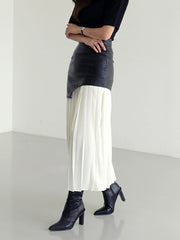 Pleated midi skirt with asymmetrical faux leather yoke