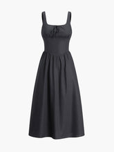 Black dress with fitted waist and bow detail