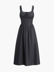 Black dress with fitted waist and bow detail