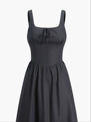 Black dress with fitted waist and bow detail