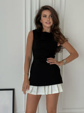 Pleated mini dress with contrasting skirt