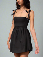 Black mini dress with bow
