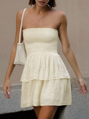 Cream-colored dress with tiered bust