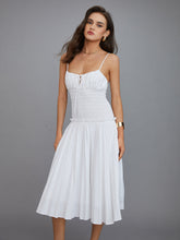 White pleated midi dress with thin straps