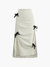 White midi skirt with black bow details