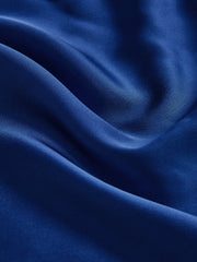 Blue satin top with bow straps and cutout