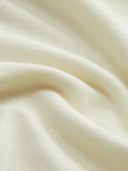 White backless top with ruffle details