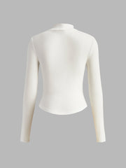 White fitted top with long sleeves and corset details