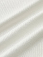 White fitted top with long sleeves and corset details