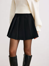 Black pleated mini skirt