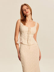 Cream peplum top with floral embroidery