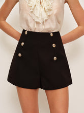 Black shorts with decorative buttons