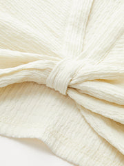 Sleeveless twisted top with structure