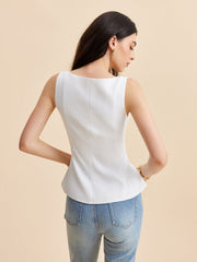 White corset top with structured peplum