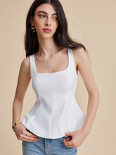 White corset top with structured peplum