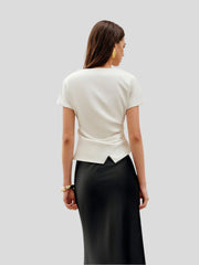 Draped top with asymmetrical hem