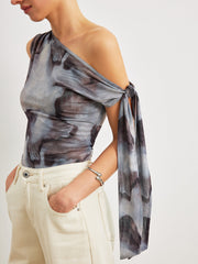 One-shoulder asymmetrical top with pattern and knots