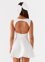 White mini dress with accentuated bust