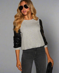 Lädersömmar långärmad rund hals