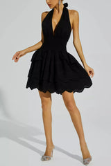 Black backless dress with embroidered ruffled skirt