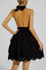 Black backless dress with embroidered ruffled skirt