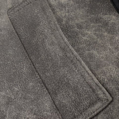 Short jacket with stand-up collar and buckle details