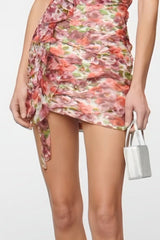 Pink strapless mini dress with pattern and draping