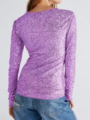 Glittrig långärmad skjorta med rund hals