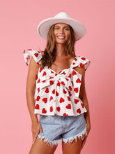 V-ringad topp med rosett och hjärtmönster