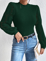 Stickad tröja med blommig ärm