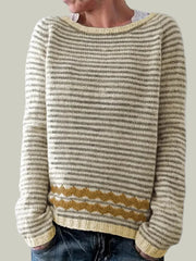 Striped knitted sweater with patterned hem