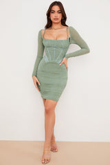 Smal korsettklänning med lång ärm