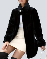Black coat with high collar and jeweled button