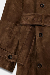 Brown trench coat with belt and shoulder details