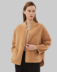 Boxy short jacket with single button closure