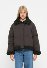 Dark brown short puffer jacket with black teddy collar and hem