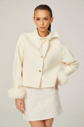 Cream short jacket with bow collar and fluffy cuffs