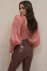 Rouge långärmad korsett med volanger