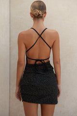 Svart miniklänning med bouclétryck