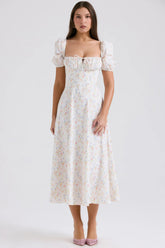 White midi dress with pastel floral pattern and puff sleeves