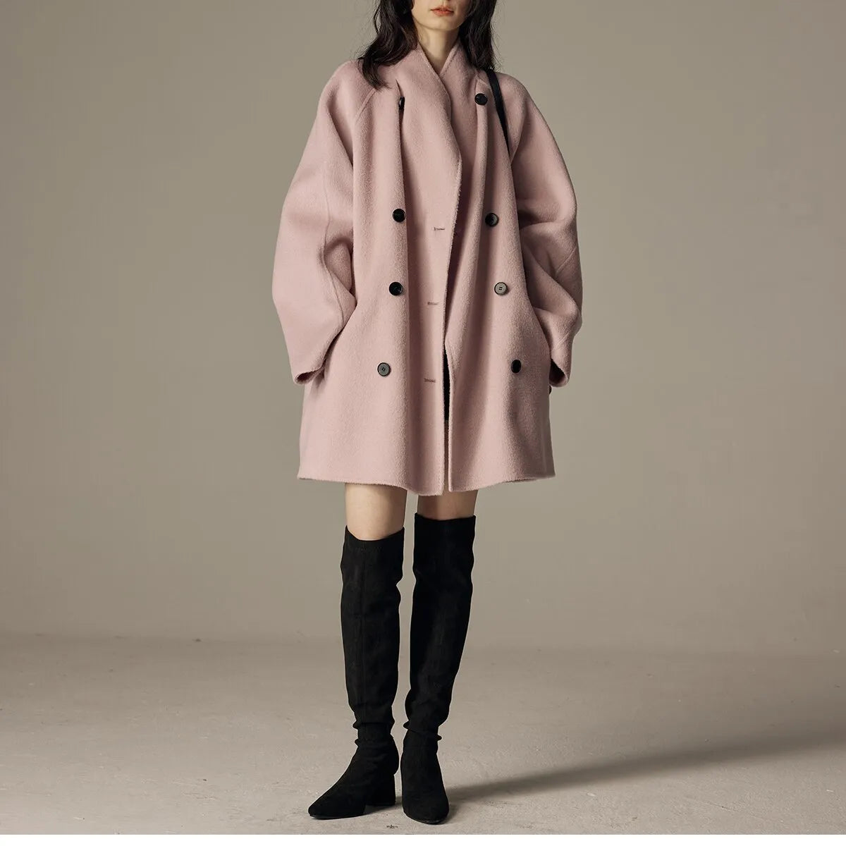 Oversized double-breasted coat with shawl collar.