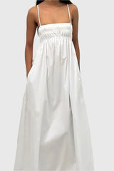 White sleeveless long dress with open back