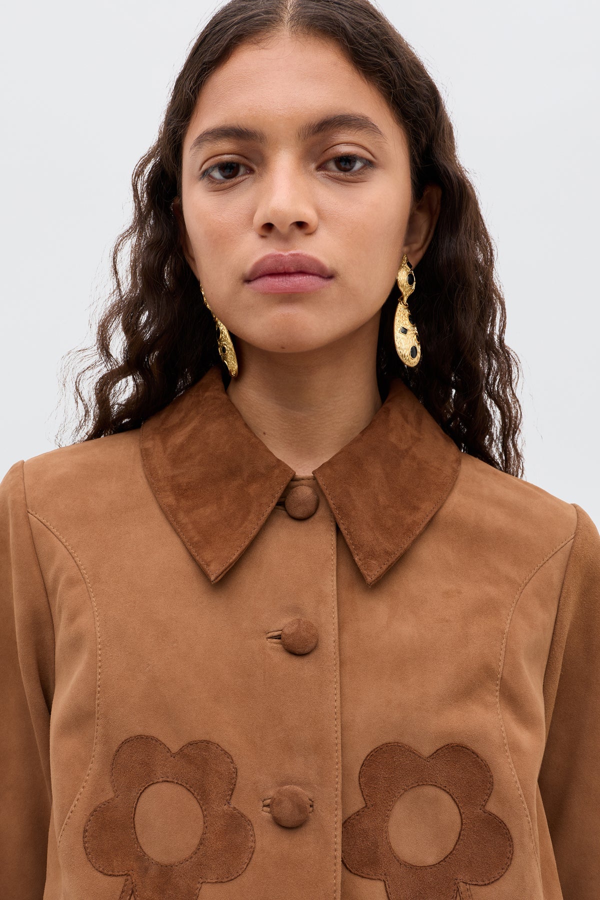 Brown short jacket with floral appliqués