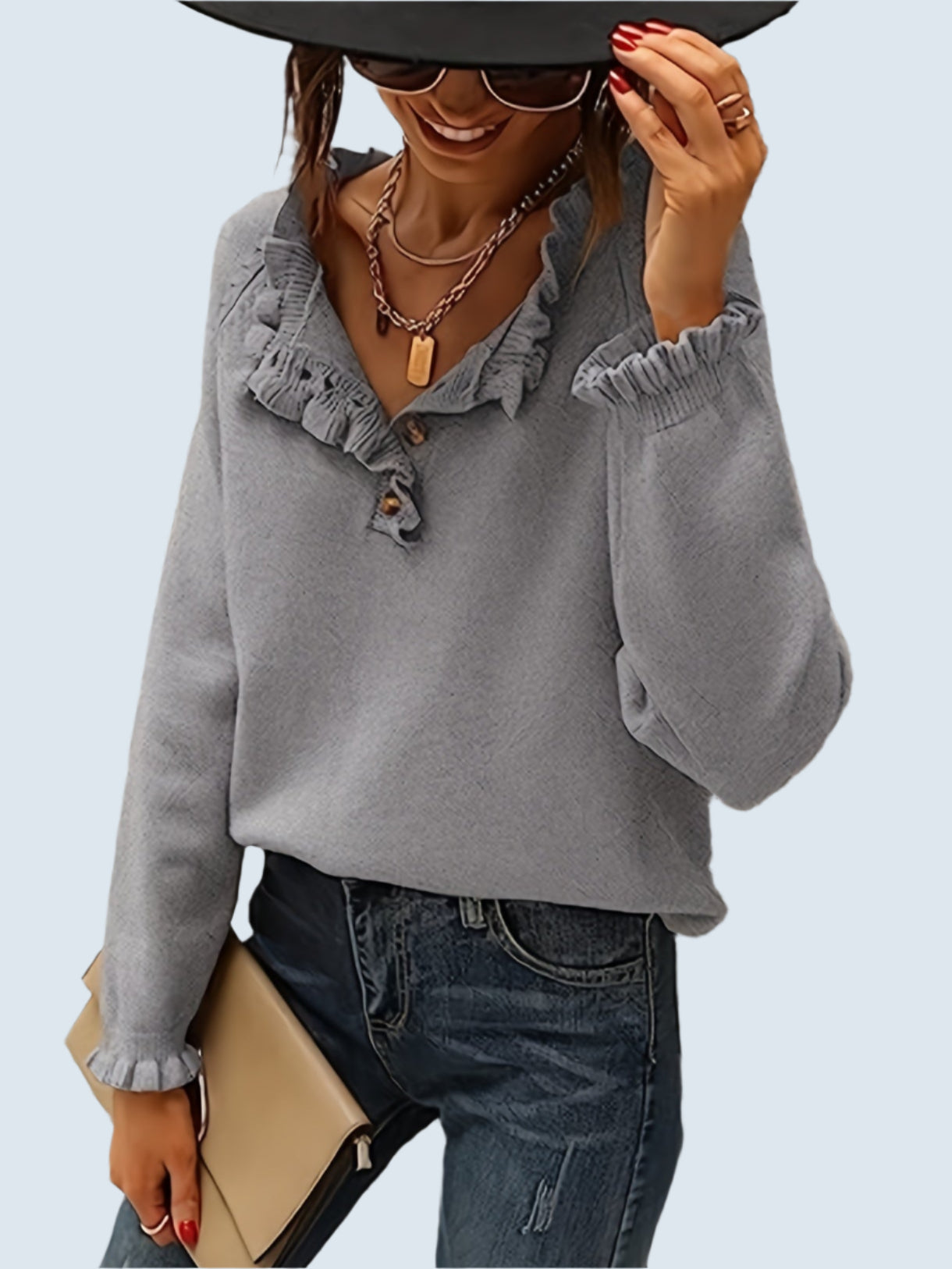 V-ringad tröja med volang i nederkanten